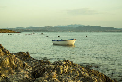 Boat in sea against sky