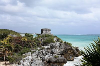 Scenic view of sea against cloudy sky