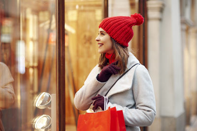 Young woman wearing hat in store