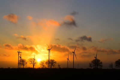 Low angle view of silhouette trees against sky during sunset