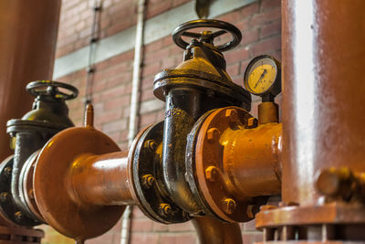 Close-up of pipes against wall