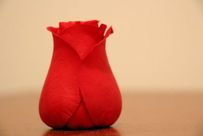 Close-up of red flower on table