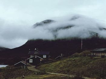 Built structure on mountain against sky