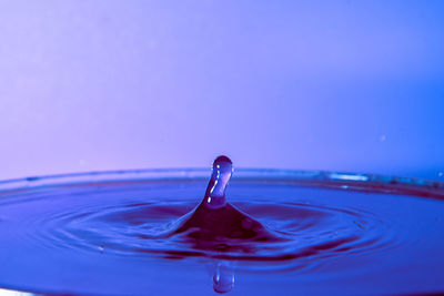 Close-up of drop splashing in water