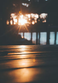 Close-up of sunlight against sky during sunset