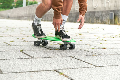 Close-up of skateboarder doing a trick at the park. concept of leisure activity, sport, extreme, hobby and motion. person