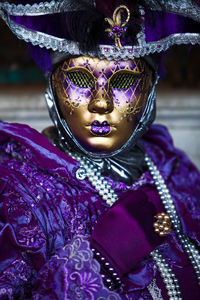 Close-up portrait of woman wearing mask