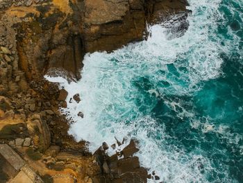 High angle view of water splashing on rocks