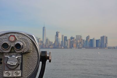 Close-up of city buildings against clear sky