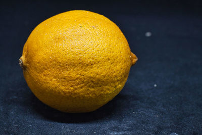 Close-up of orange fruit on table