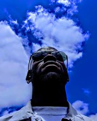 Low angle view of statue against blue sky