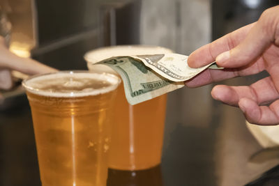 Close-up of hand holding drink