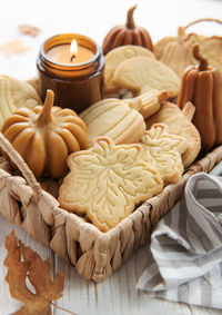 Autumn baking. cookies in the form of pumpkin and leaves on the table. cozy autumn concept.