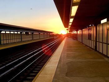 Railroad station platform at sunset