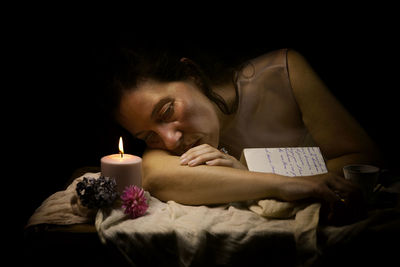 Woman in romantic attitude reading a love letter ii