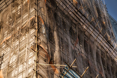 Low angle view of building under construction against sky