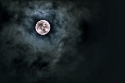 Low angle view of moon against sky at night