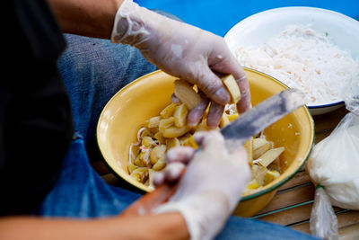 Midsection of woman preparing food