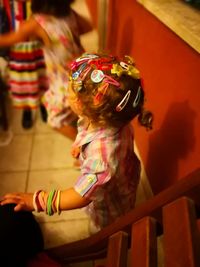Full length of woman with toy standing by railing