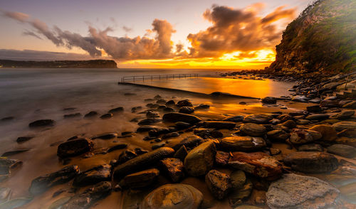 Scenic view of sea against sky during sunset