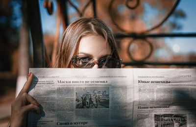 Portrait of woman holding book