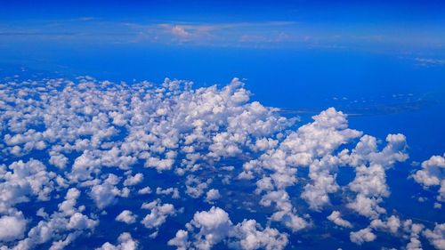 Low angle view of white clouds in blue sky