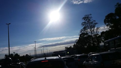 Cars on road against sky