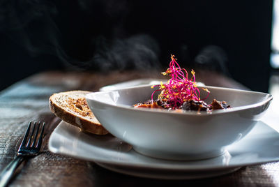 Close-up of food served on wooden table at restaurant