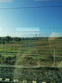 Scenic view of field against clear sky