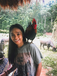 Portrait of smiling young woman with horse