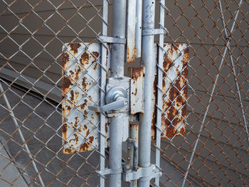 Close-up of rusty metal fence