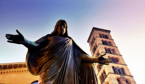 Low angle view of statue against building