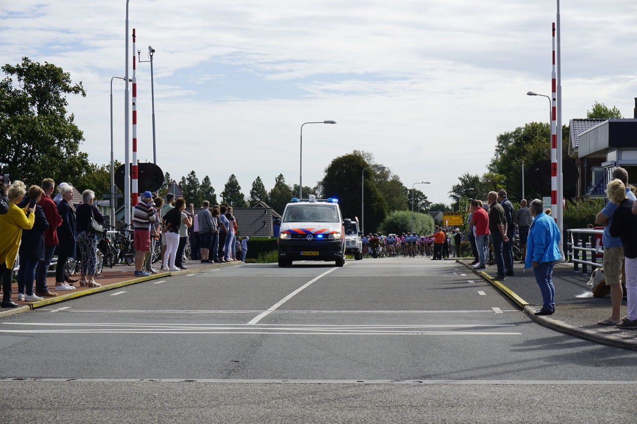 PEOPLE ON ROAD IN CITY