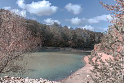 View of lake against cloudy sky