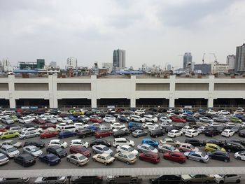 Parking place in city against sky