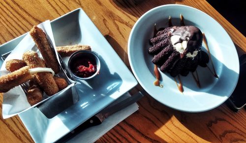 High angle view of chocolate cake in plate on table