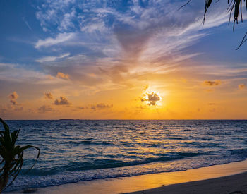 Scenic view of sea against sky during sunset