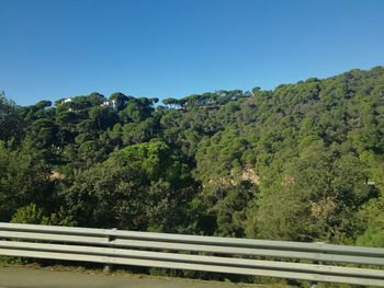 Scenic view of mountains against clear blue sky