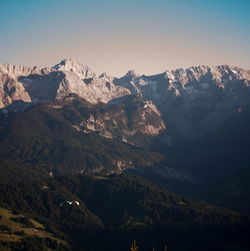 Scenic view of mountains against cloudy sky