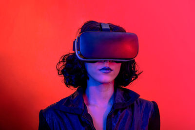 Woman is using the virtual reality headset.modern woman portrait with trendy look and bright colors.