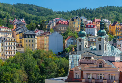 Buildings in town against clear sky