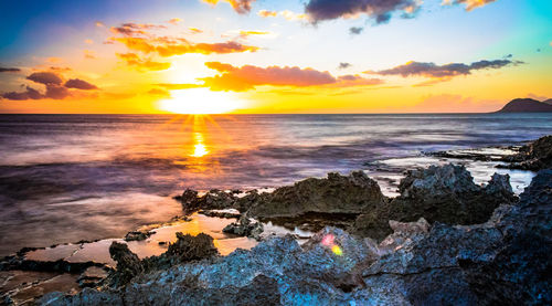 Scenic view of sea against sky during sunset