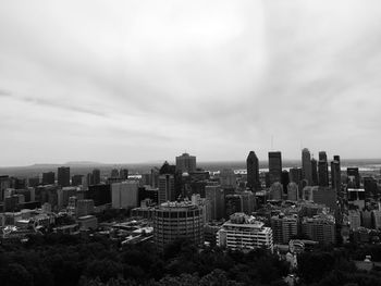 Modern buildings in city against sky