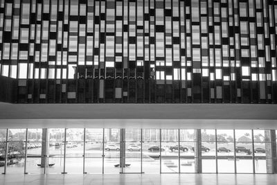 Reflection of building on glass window at night