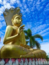 Low angle view of statue against trees