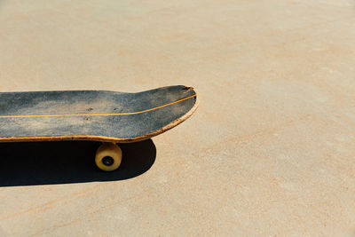 High angle view of skateboard on beach