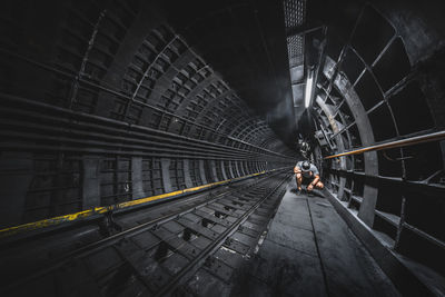 People on railroad bridge