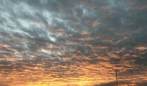 Low angle view of dramatic sky during sunset