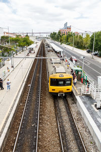 High angle view of train at railroad station in city