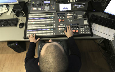 Man mixing music in recording studio